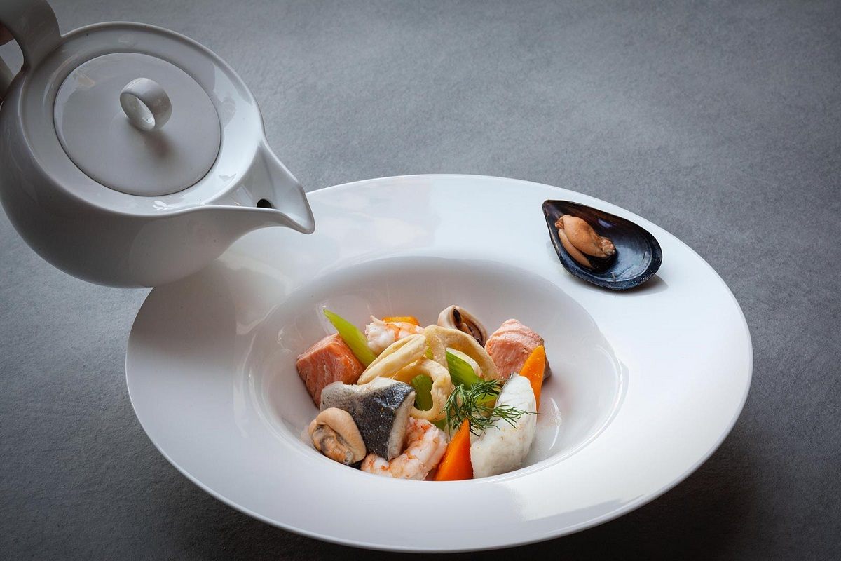 A composed seafood dish from a fine dining menu